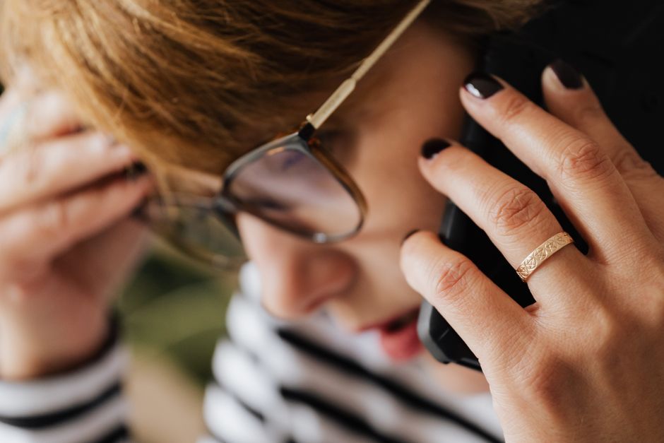 Episode 6: The Sunday Evening Family Update Panic Side view of thoughtful anxious woman in eyeglasses touching head while having phone conversation
